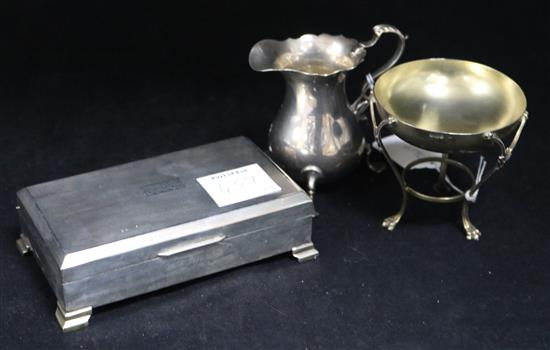 A silver milk jug and a Empire style silver bon-bon dish and a cigarette box.